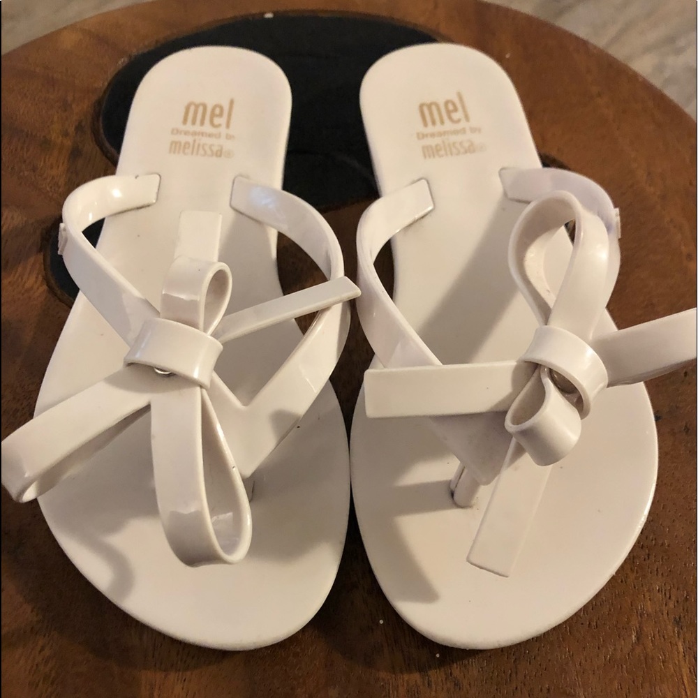 Size 11 mini Melissa flip flops